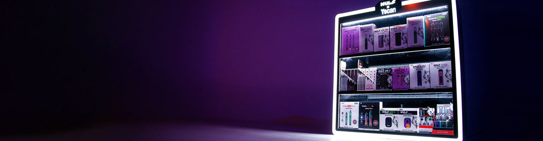 Got Vape Wholesale Display Case sitting on white table inside studio with purple lighting